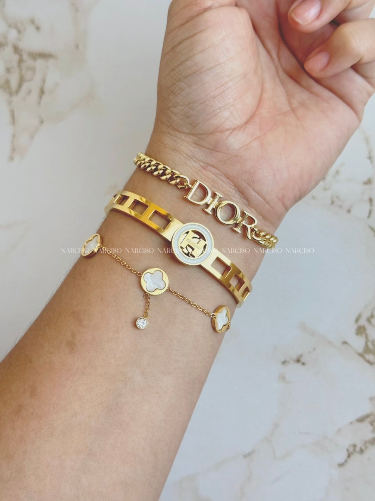 Hermes dorado y blanco