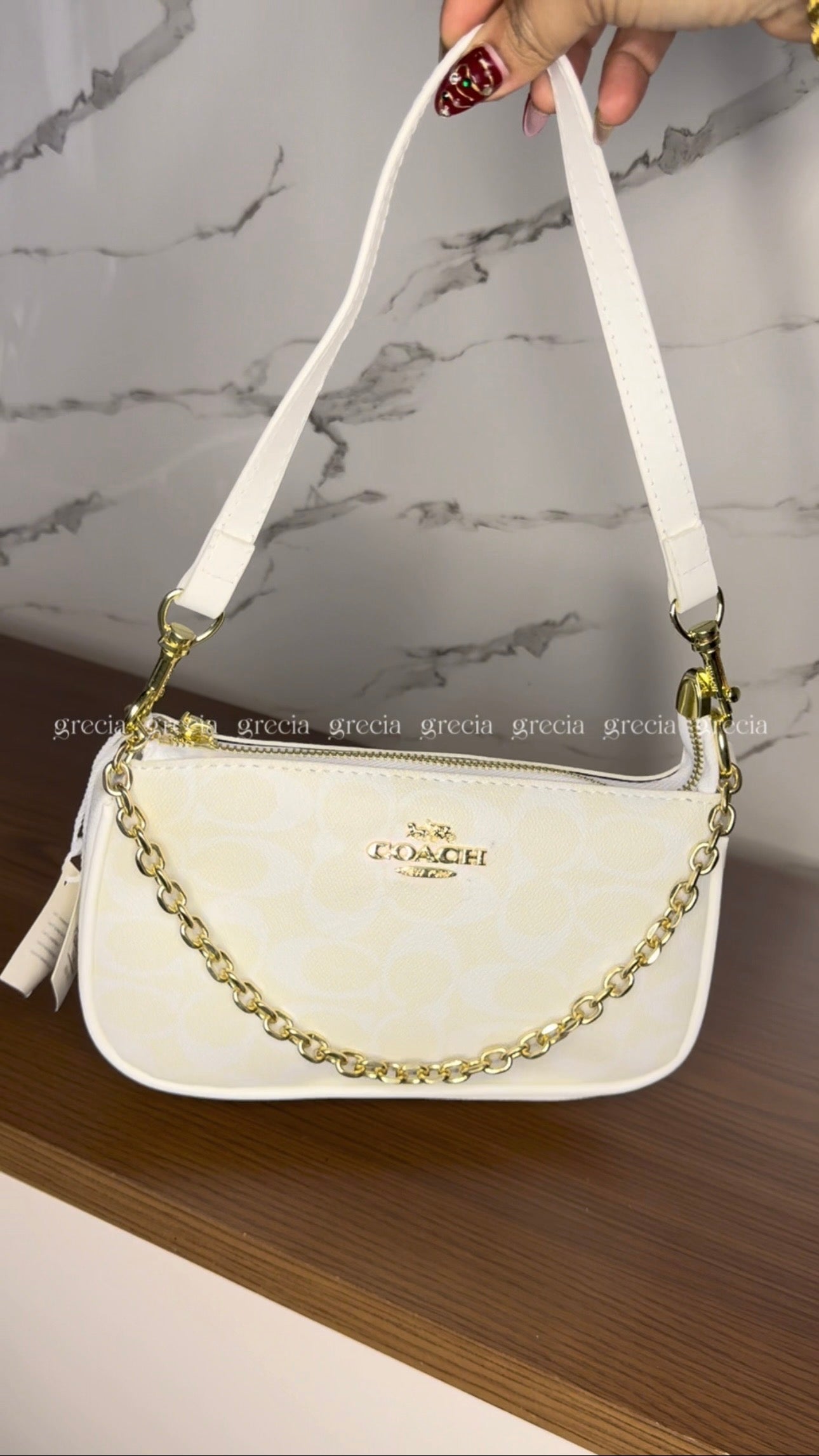 Coach Notita blanca