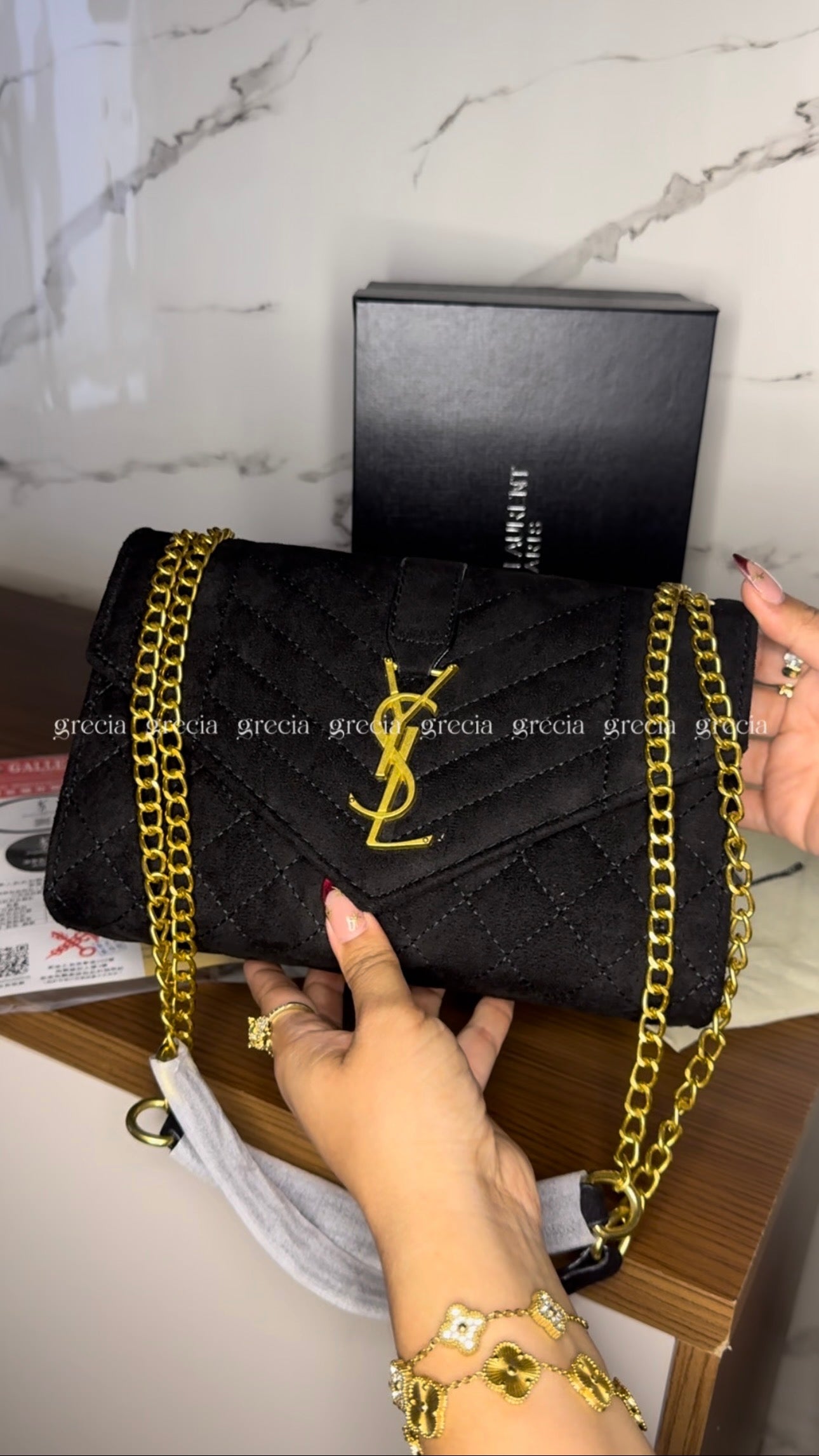 YSL negra con dorado