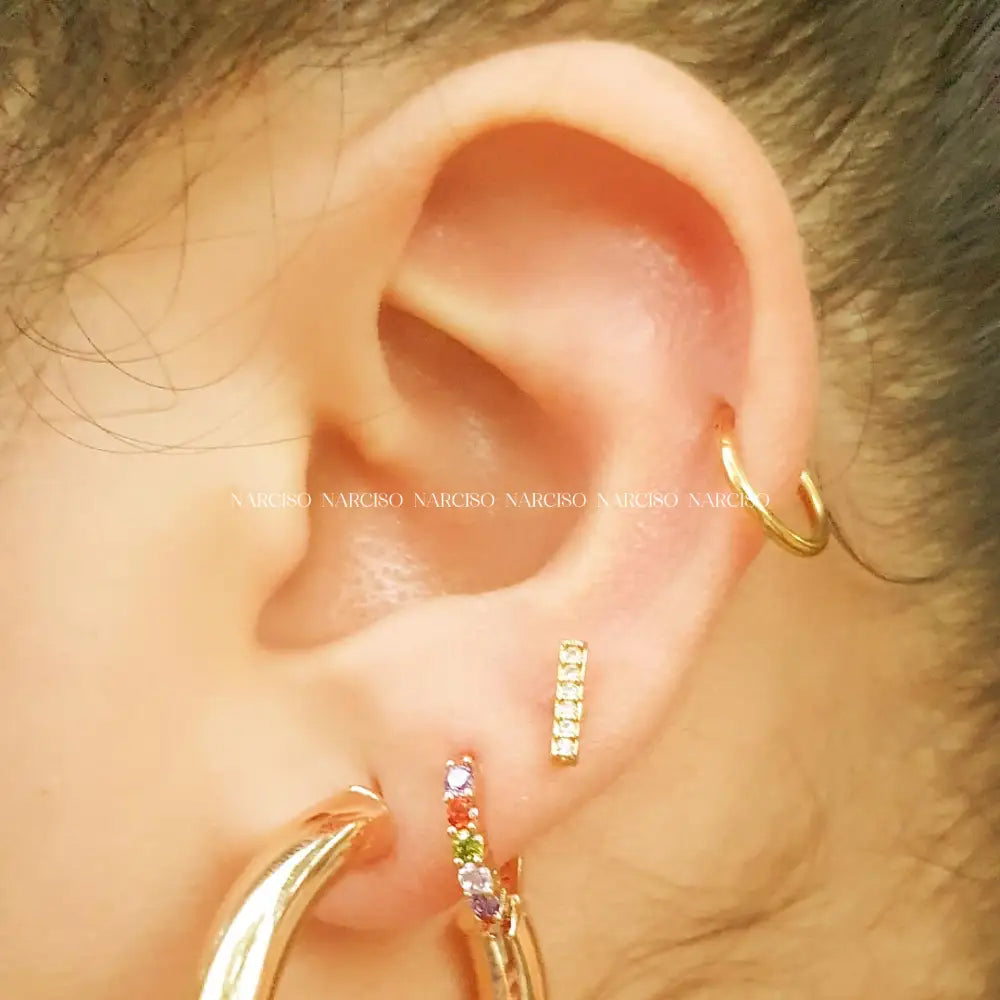 Infinita Dorada Piercings