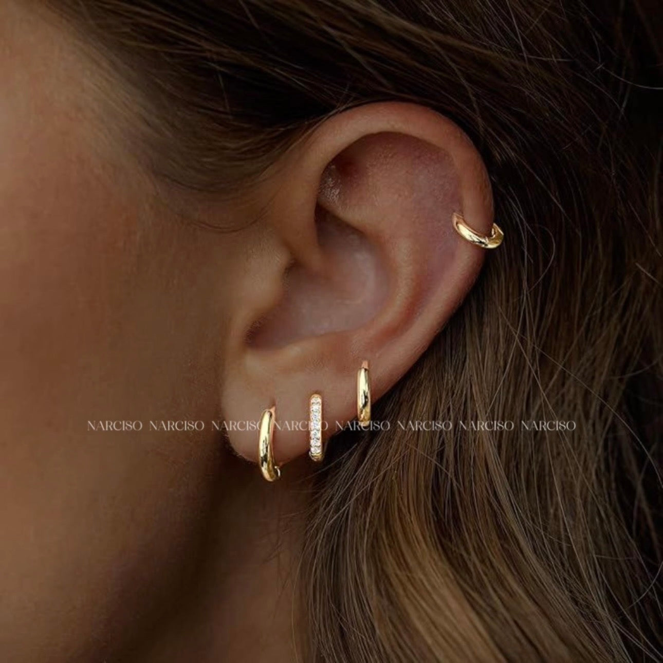 Trío de piercings