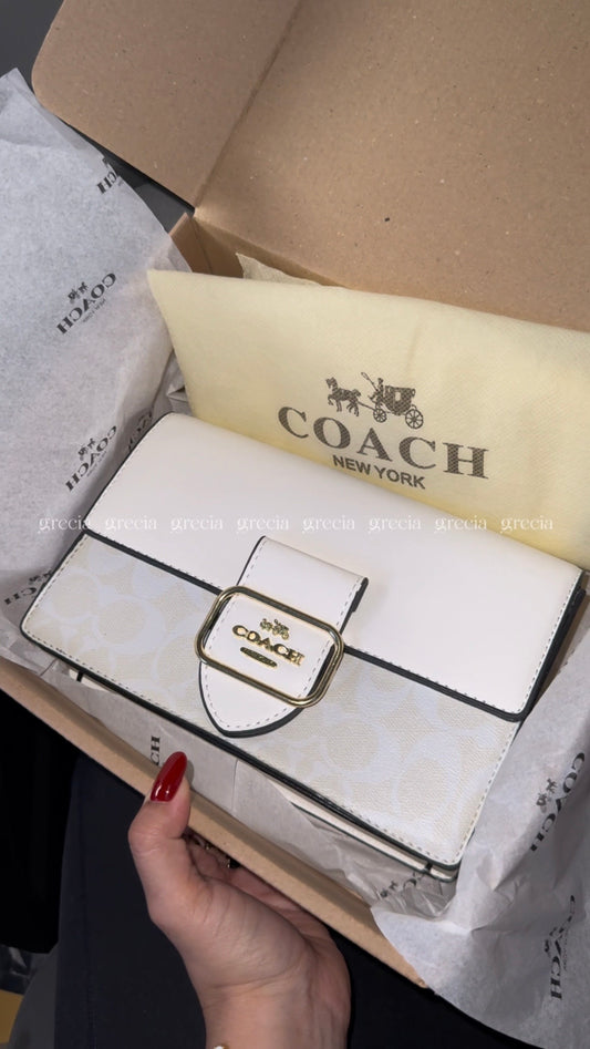 Coach blanca