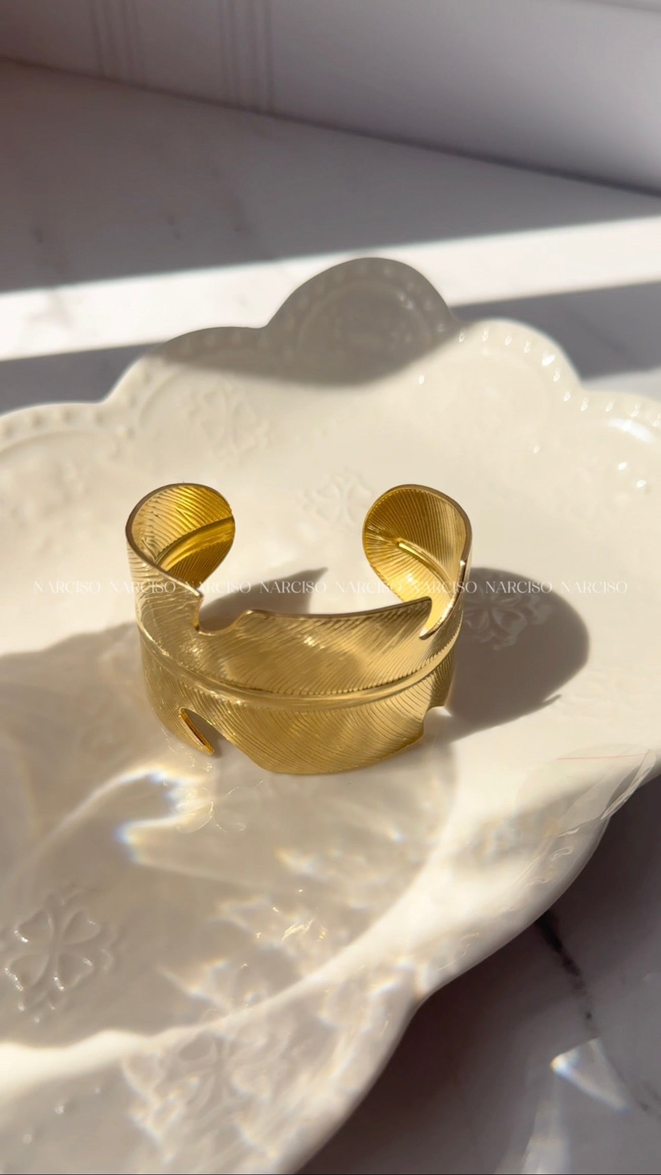 Brazalete pluma