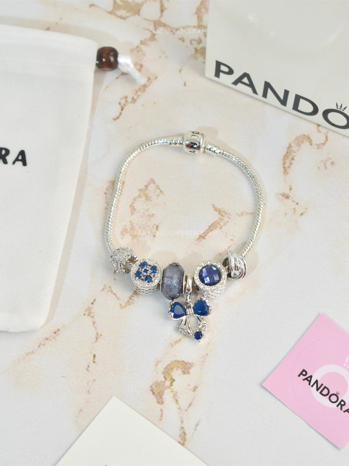 Pandora azul con moñita
