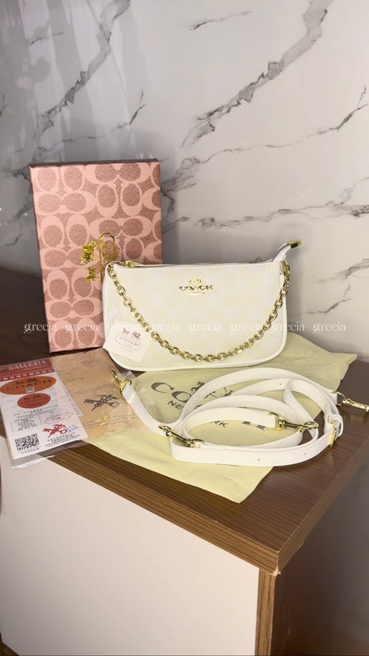 Coach Notita blanca