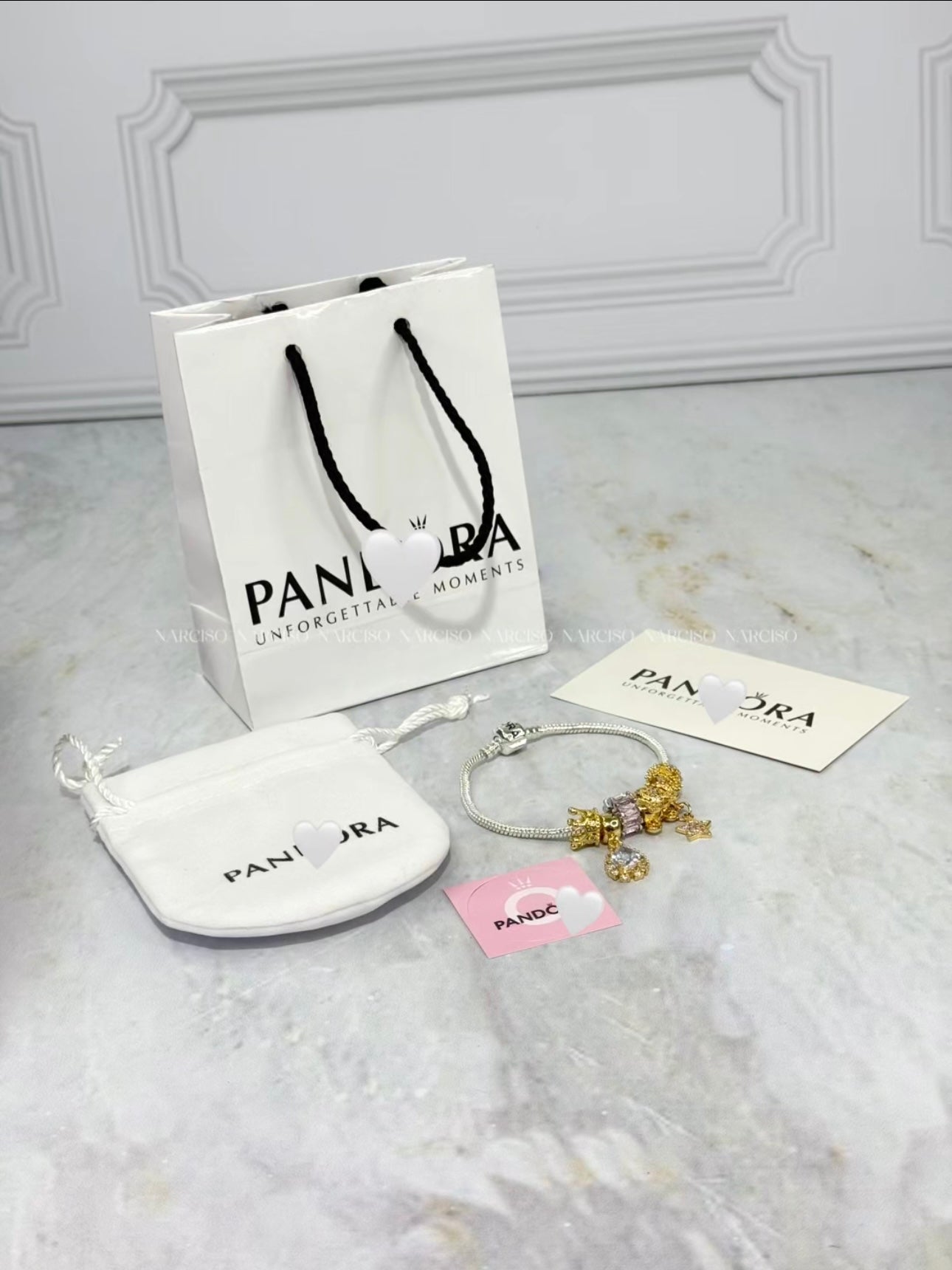 Pandora rosado, plateado y dorado