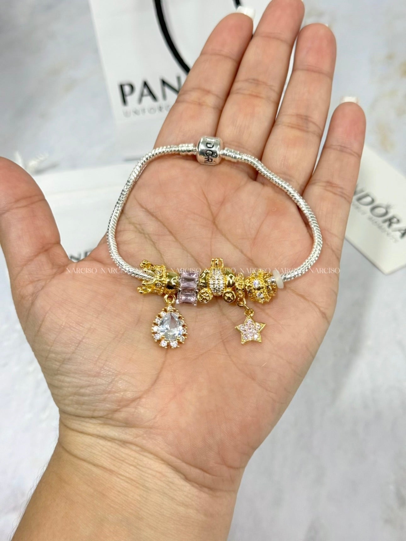 Pandora rosado, plateado y dorado