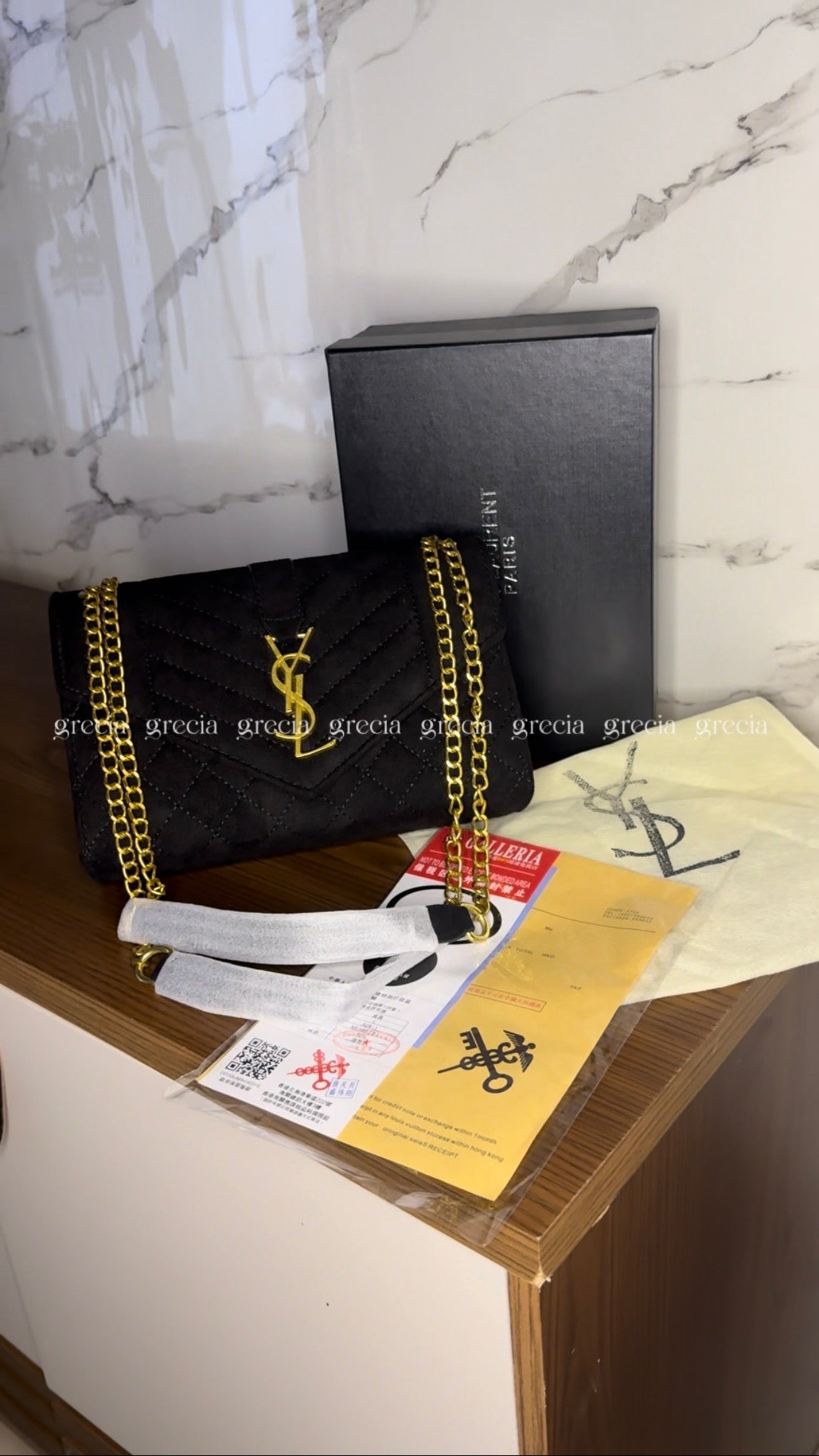 YSL negra con dorado