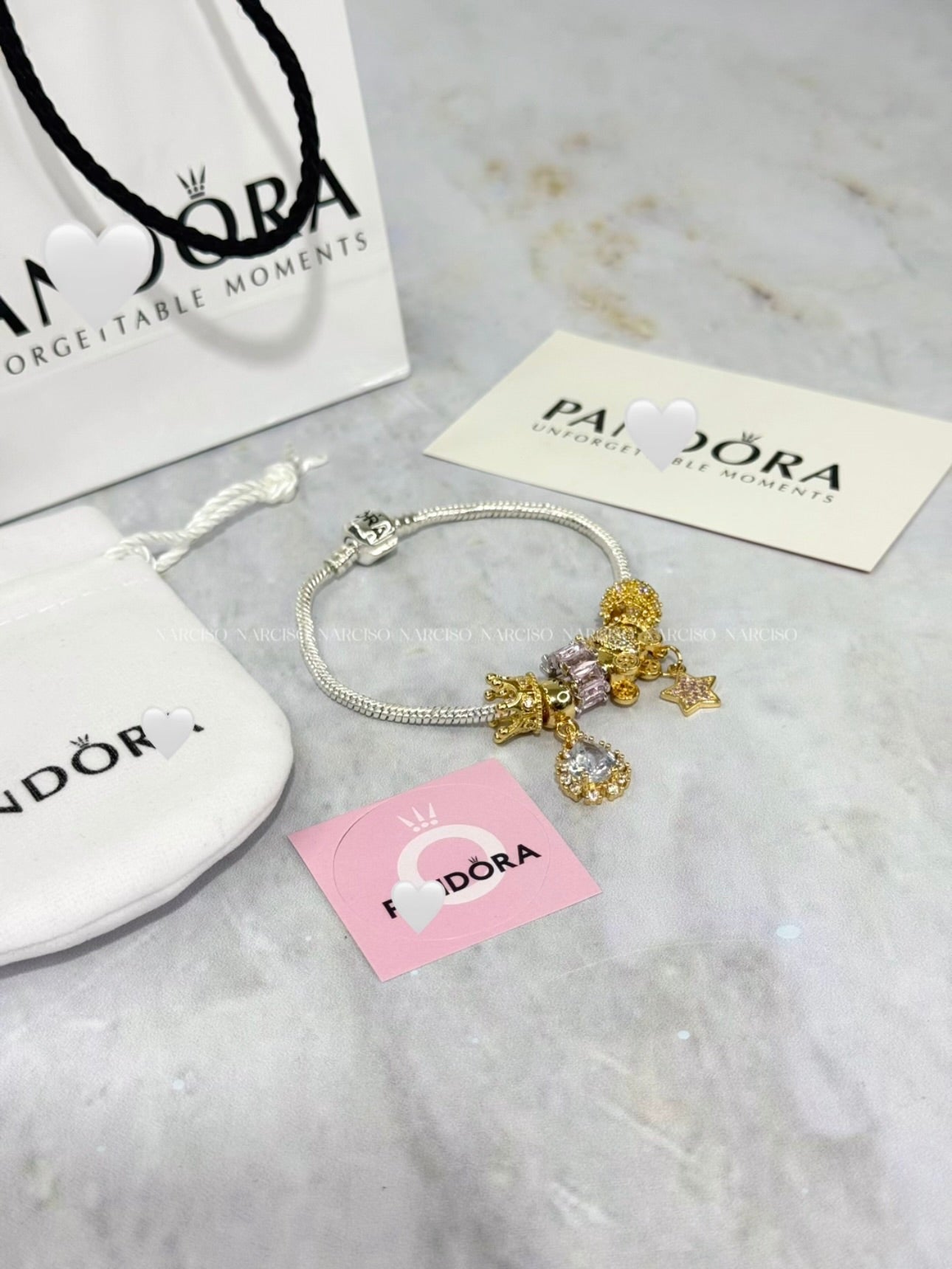 Pandora rosado, plateado y dorado