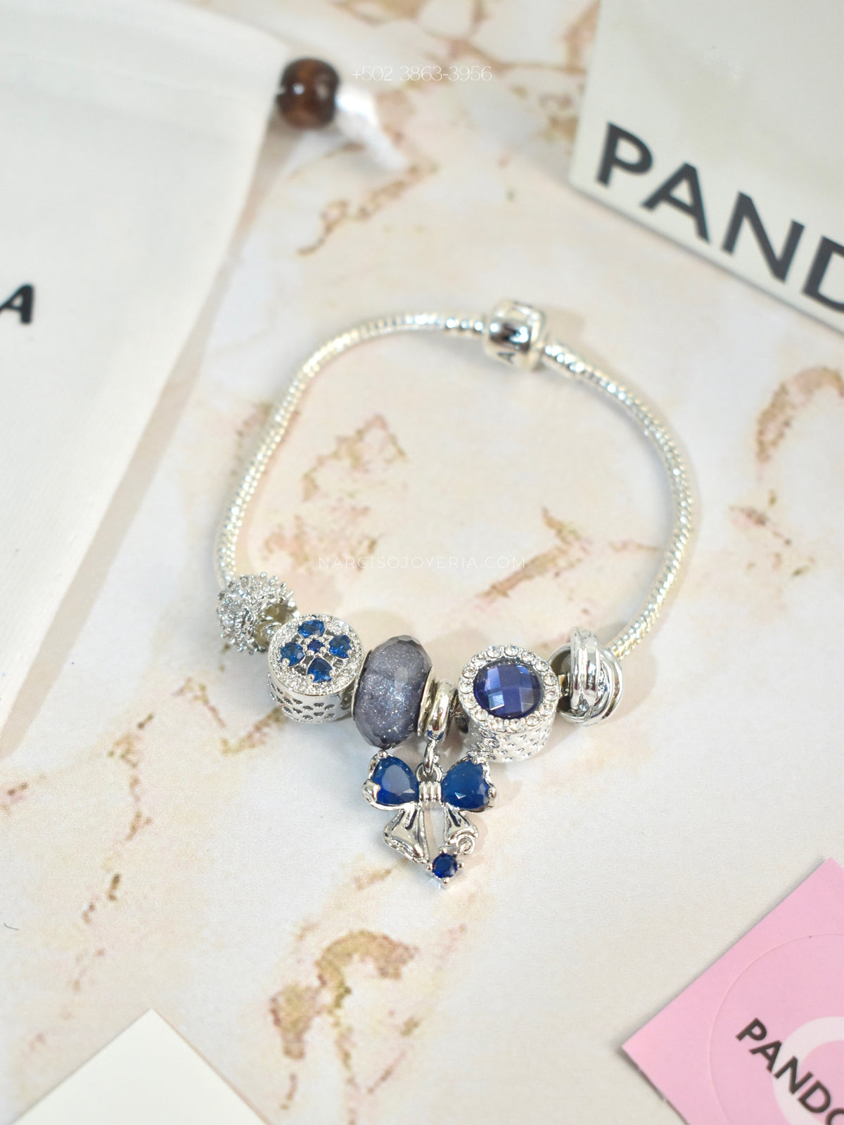Pandora azul con moñita