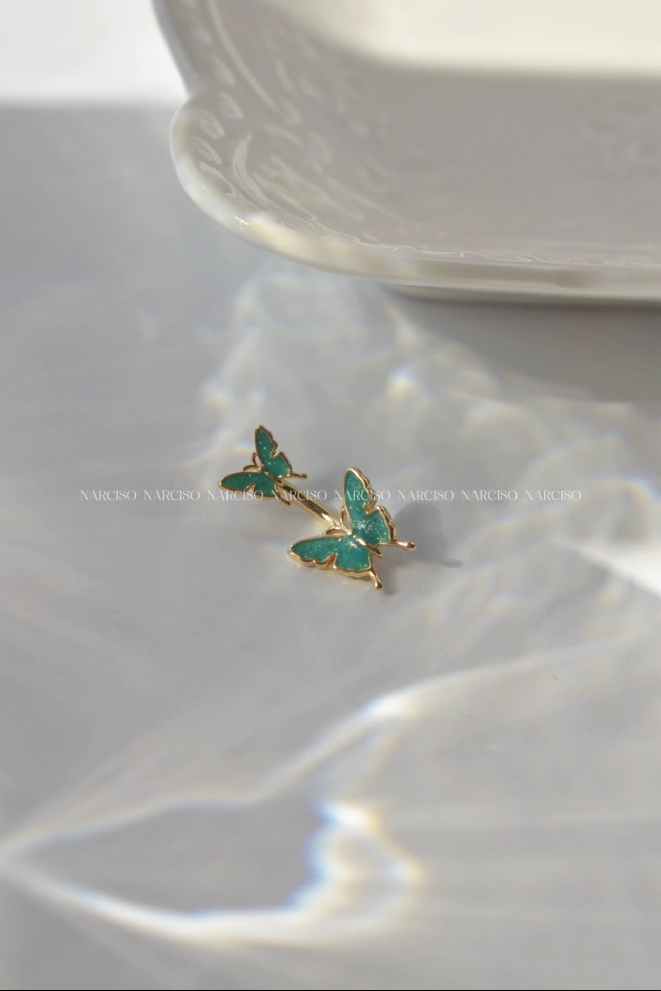 Piercing ombligo mariposa