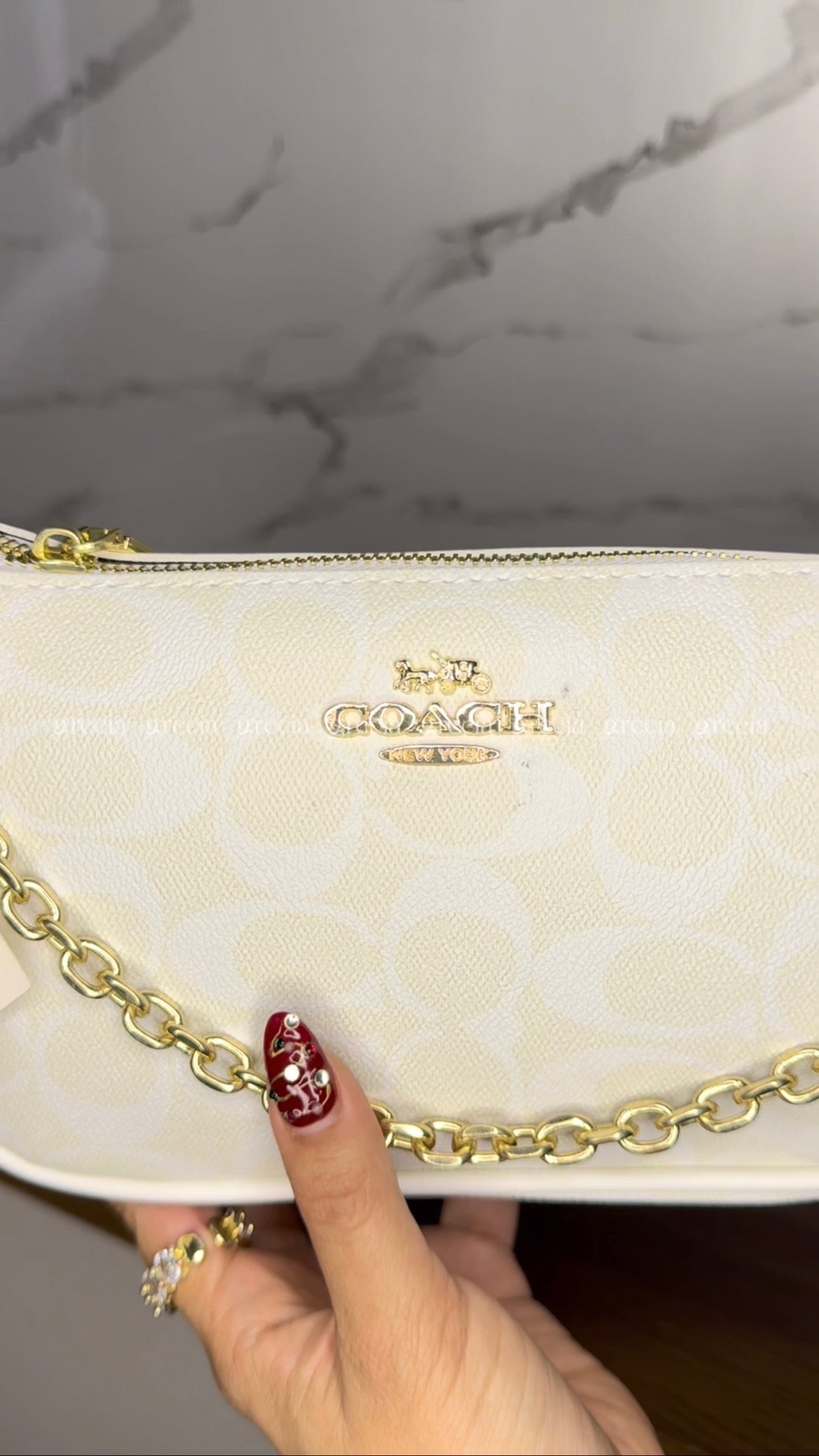 Coach Notita blanca
