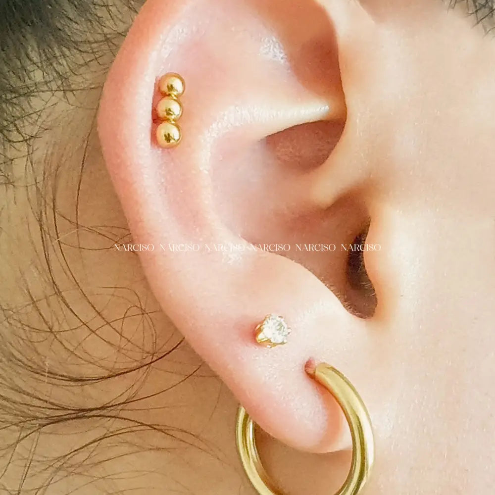 Triple Bolita Dorada Piercings